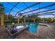 Enclosed pool area with spa and plenty of room for sunbathing at 2340 Bayshore Rd, Nokomis, FL 34275