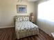 Cozy bedroom with a double bed and light wood flooring at 519 Albee Farm Rd # 317, Venice, FL 34285