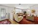 An inviting living room filled with natural light, cozy seating, and stylish decor at 566 Viridian St, Englewood, FL 34223
