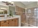 Bathroom with walk-in shower and tiled walls at 1221 Creek Nine Dr, North Port, FL 34291