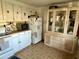 Kitchen with white cabinets, microwave, and refrigerator at 5220 Palena Blvd, North Port, FL 34287