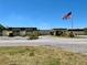 Community center with ample parking and flagpole at 5220 Palena Blvd, North Port, FL 34287