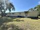 Full view of mobile home showcasing its length and yard at 5220 Palena Blvd, North Port, FL 34287