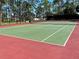 Green tennis court with red boundary lines at 5220 Palena Blvd, North Port, FL 34287