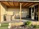 Inviting covered patio with wicker furniture, perfect for relaxing outdoors at 5220 Palena Blvd, North Port, FL 34287