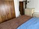 Main bedroom with full bed, dresser, and large closet at 5220 Palena Blvd, North Port, FL 34287