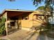 Mobile home with carport and mature landscaping at 5220 Palena Blvd, North Port, FL 34287