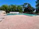 Relaxing community pool area with plenty of lounge chairs at 5220 Palena Blvd, North Port, FL 34287