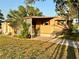 Mobile home with carport and mature landscaping at 5220 Palena Blvd, North Port, FL 34287