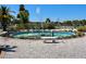 Circular fountain with dolphin statues and bench at 5220 Palena Blvd, North Port, FL 34287