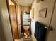 Compact bathroom with a toilet, storage cabinet, and towel rack at 5220 Palena Blvd, North Port, FL 34287