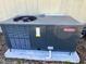 Goodman brand AC unit sits on a concrete slab at 5220 Palena Blvd, North Port, FL 34287