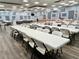 Large community room with tables and chairs for meetings at 5220 Palena Blvd, North Port, FL 34287