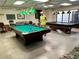 Relaxing game room with billiard tables for entertainment at 5220 Palena Blvd, North Port, FL 34287