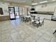 Spacious community room with tables and chairs, ideal for gatherings at 5220 Palena Blvd, North Port, FL 34287