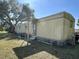 Mobile home with covered porch and AC unit at 5220 Palena Blvd, North Port, FL 34287