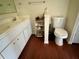 Bathroom with double vanity, toilet and linen storage at 5220 Palena Blvd, North Port, FL 34287
