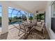 Spacious covered patio featuring a dining table and seating at 14462 Fort Worth Cir, Port Charlotte, FL 33981