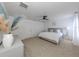 Main bedroom with king-size bed, ceiling fan, and ample space at 14462 Fort Worth Cir, Port Charlotte, FL 33981
