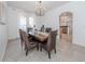 Elegant dining room with a large wooden table and wicker chairs at 14462 Fort Worth Cir, Port Charlotte, FL 33981