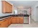 Modern kitchen with stainless steel appliances and granite countertops at 14462 Fort Worth Cir, Port Charlotte, FL 33981