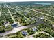 Aerial view of waterfront homes and properties in a residential neighborhood at 14462 Fort Worth Cir, Port Charlotte, FL 33981