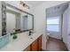 Bathroom with single vanity, mirror, and shower/tub combo at 14462 Fort Worth Cir, Port Charlotte, FL 33981