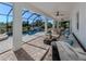 Covered patio with comfortable seating and dining area at 14462 Fort Worth Cir, Port Charlotte, FL 33981