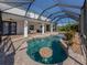 Enjoy this refreshing pool with a covered patio and seating area at 14462 Fort Worth Cir, Port Charlotte, FL 33981