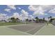 Tennis court with surrounding greenery at 14462 Fort Worth Cir, Port Charlotte, FL 33981