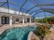 Screened pool and patio with ample space for lounging and entertaining at 14462 Fort Worth Cir, Port Charlotte, FL 33981