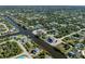 Aerial view of a neighborhood with waterfront properties and canals at 14462 Fort Worth Cir, Port Charlotte, FL 33981