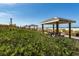 Beachfront view featuring picnic pavilions, a lighthouse, and sandy beach at 14462 Fort Worth Cir, Port Charlotte, FL 33981