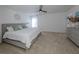 King-size bed in a bright and airy bedroom with large windows at 14462 Fort Worth Cir, Port Charlotte, FL 33981