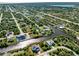 Aerial view showing a single Gathering home's location in a residential neighborhood at 14462 Fort Worth Cir, Port Charlotte, FL 33981