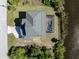 Aerial view of a house near the water with a screened-in pool at 14462 Fort Worth Cir, Port Charlotte, FL 33981