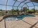 Relax in the tranquil screened pool with water features at 14462 Fort Worth Cir, Port Charlotte, FL 33981