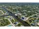Aerial view of a neighborhood with waterfront properties and canals at 14462 Fort Worth Cir, Port Charlotte, FL 33981