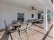 Enjoy this relaxing covered patio with comfortable seating and a dining area at 14462 Fort Worth Cir, Port Charlotte, FL 33981