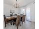 Bright dining room featuring a wood table and stylish chandelier at 14462 Fort Worth Cir, Port Charlotte, FL 33981
