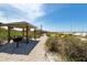 Picnic area on the beach with grills and lighthouse in the background at 14462 Fort Worth Cir, Port Charlotte, FL 33981