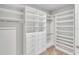 Large walk-in closet with custom shelving and drawers at 20450 Bandera Pl, Venice, FL 34293