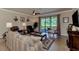 Spacious living room featuring comfortable seating and a view of the backyard at 12297 Canavese Ln, Venice, FL 34293