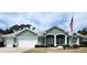 Beautiful home with two-car garage and lush landscaping at 2454 Sonoma W Dr, Nokomis, FL 34275
