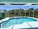 Inviting screened-in pool with ample deck space at 2454 Sonoma W Dr, Nokomis, FL 34275