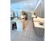 Open kitchen with breakfast bar and stainless steel appliances at 2454 Sonoma W Dr, Nokomis, FL 34275
