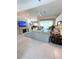 Bright living room showcasing a fireplace and pool view at 2454 Sonoma W Dr, Nokomis, FL 34275