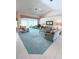 Open living room with a view of the pool and lanai at 2454 Sonoma W Dr, Nokomis, FL 34275