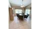 Bright breakfast nook features a table and four chairs, offering a casual dining space at 2454 Sonoma W Dr, Nokomis, FL 34275