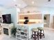 Kitchen with island, breakfast bar and fireplace at 2454 Sonoma W Dr, Nokomis, FL 34275